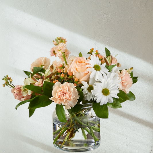 Abundant of fresh seasonal flowers designed in a glass vase. Delivered by Bendigo Florist Blumetown. 