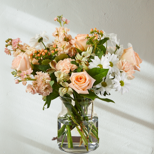Abundant of fresh seasonal flowers designed in a glass vase. Delivered by Bendigo Florist Blumetown. 