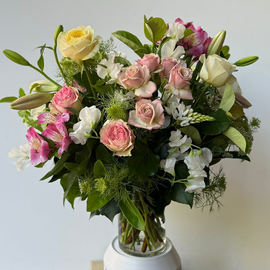 Abundant of fresh seasonal flowers designed in a glass vase. Delivered by Bendigo Florist Blumetown. 