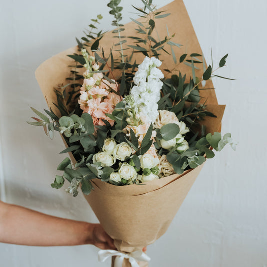 Soft pastel seasonal flowers in Bendigo wrapped in white paper and tissue.  Bendigo Florist. 