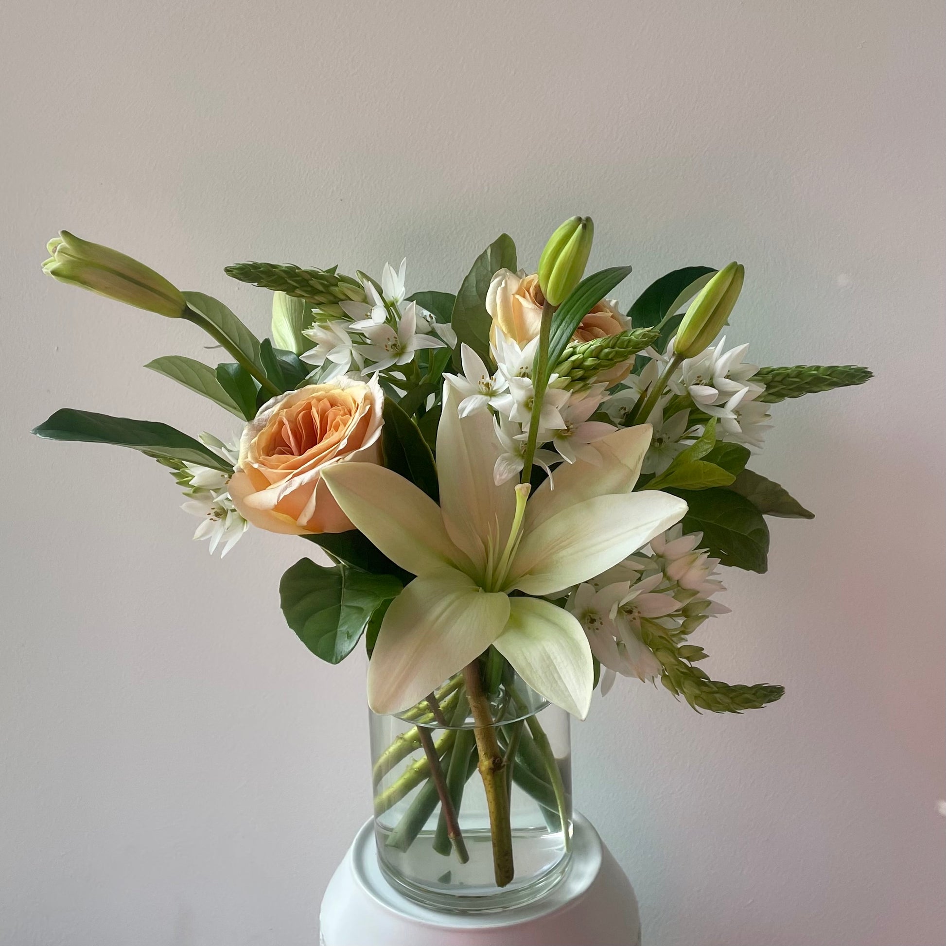 Soft pretty flowers in white & green presented in a glass vase. Designed by Bendigo Florist Blumetown. 