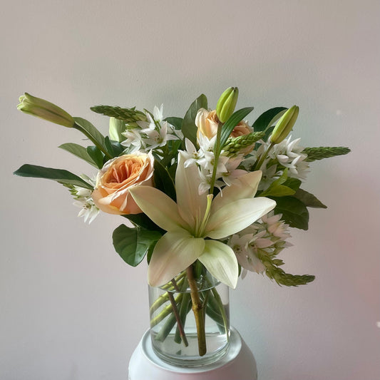 Soft pretty flowers in white & green presented in a glass vase. Designed by Bendigo Florist Blumetown. 