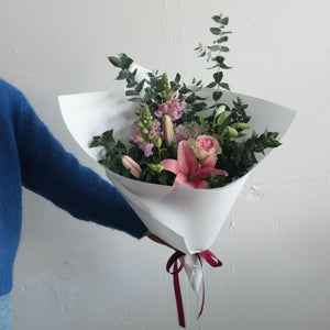 Pastel pink and white flowers designed by Bendigo Florist Blumetown. Designed and wrapped in white paper. 
