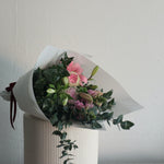 Load image into Gallery viewer, Soft pastel seasonal flowers wrapped in white Kraft paper with burgundy ribbon. Designed by Bendigo florist Blumetown.
